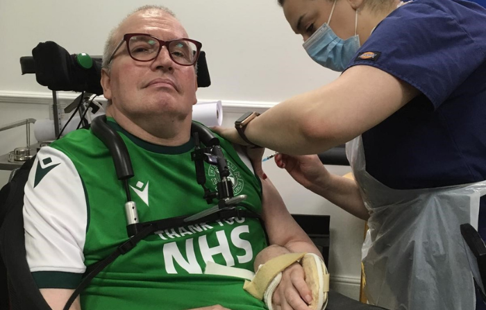 Graham receiving his Covid vaccine